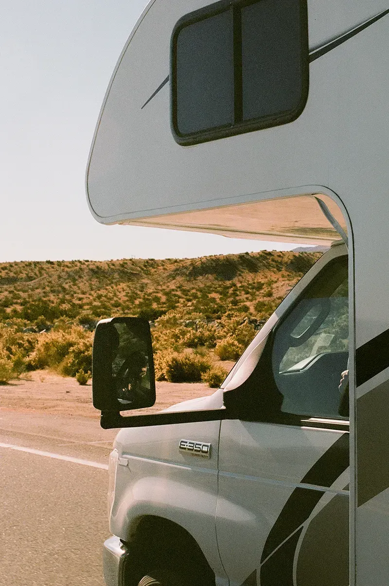 Close up image of an RV driving down the road